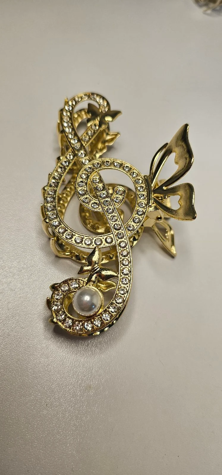 Gold rhinestone treble clef butterfly hair claw clip