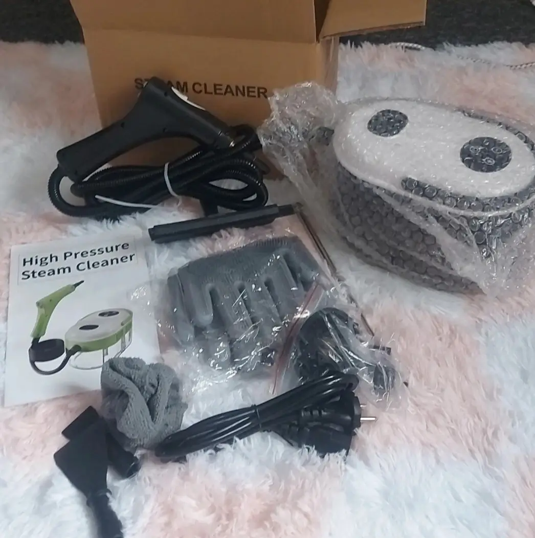 Brand new boxed portable steam cleaner with accessories
