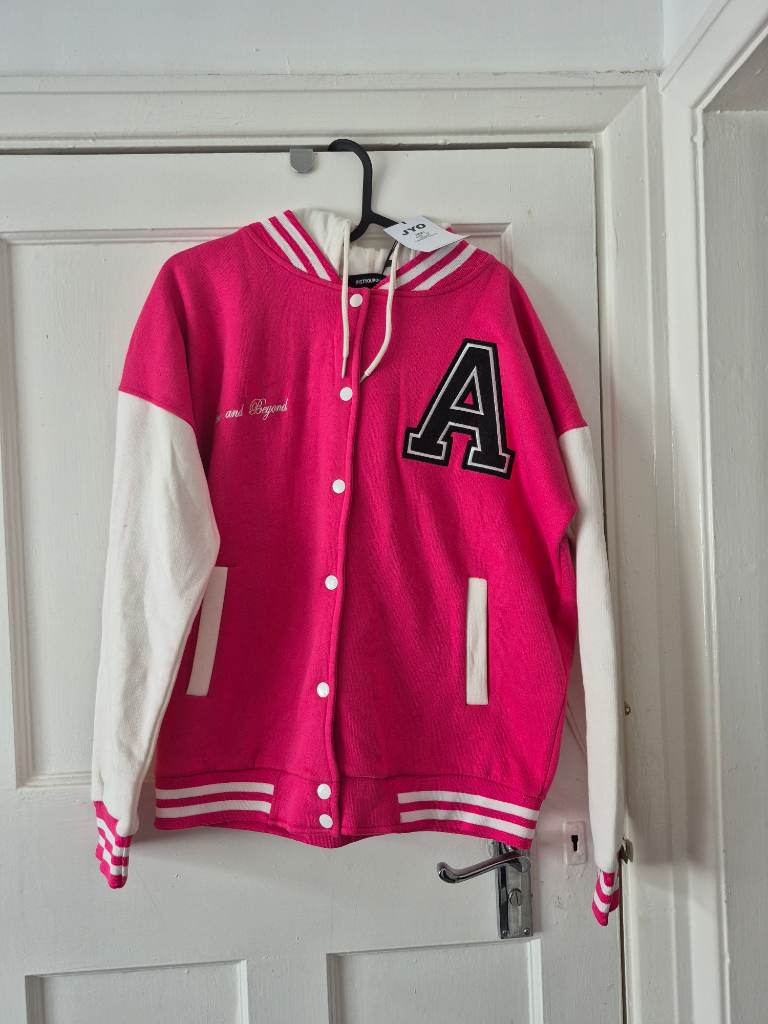 Brand new varsity jacket size 10