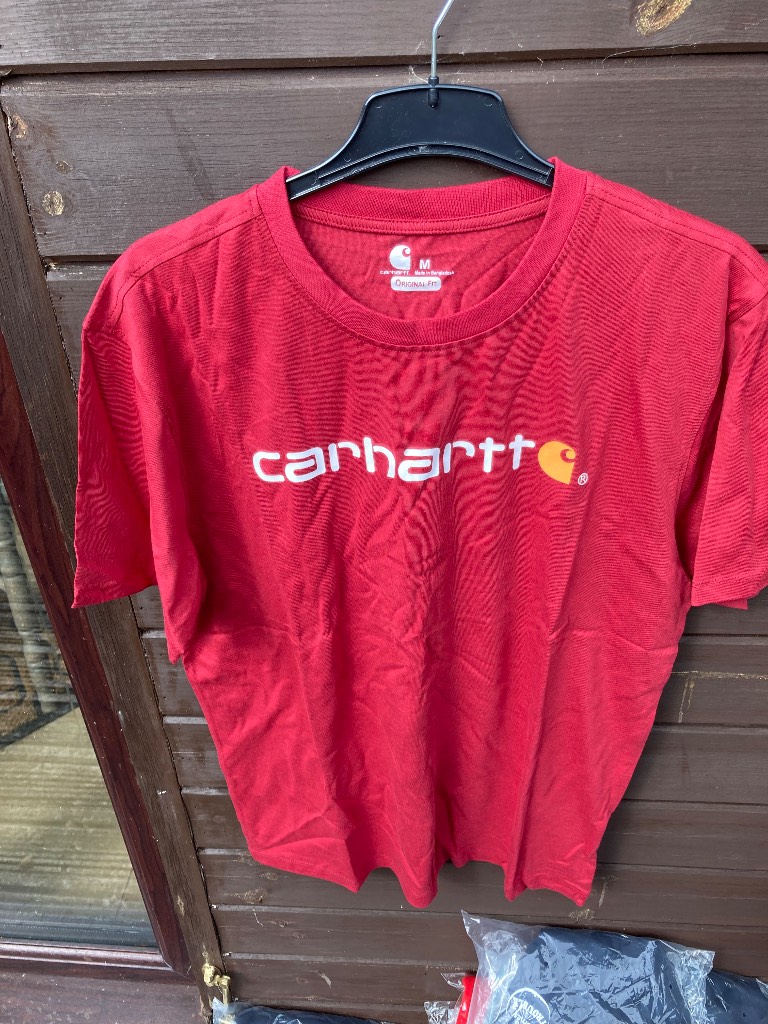 Carhartt Red teeshirt with motif on front. Size M