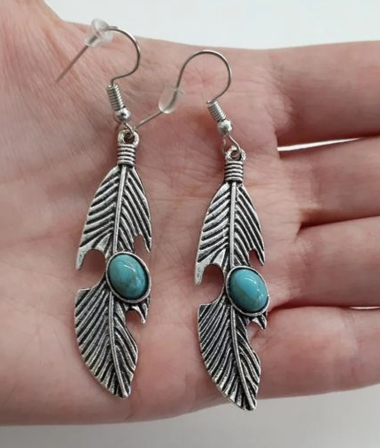 vintage-inspired bohemian feather earrings .