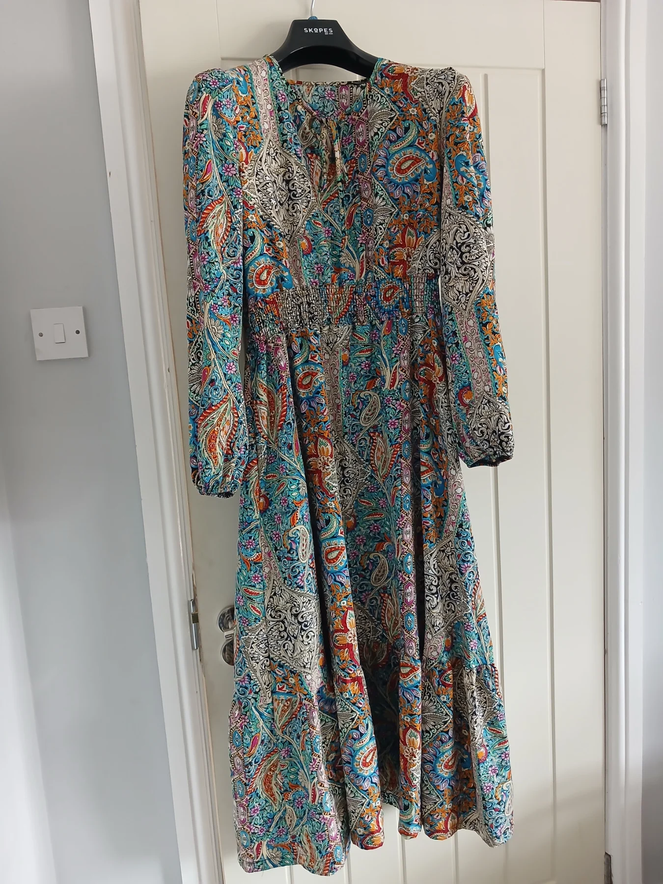 This colourful long-sleeve maxi dress.