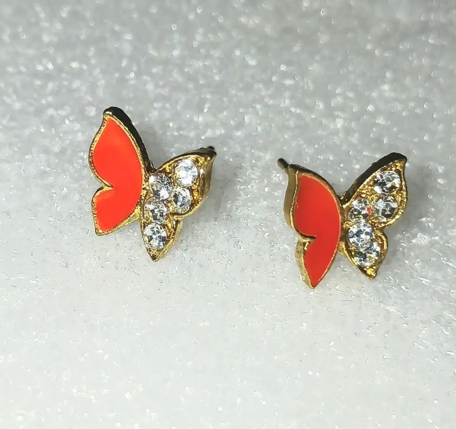 pair of gold-toned butterfly-shaped stud earrings.
