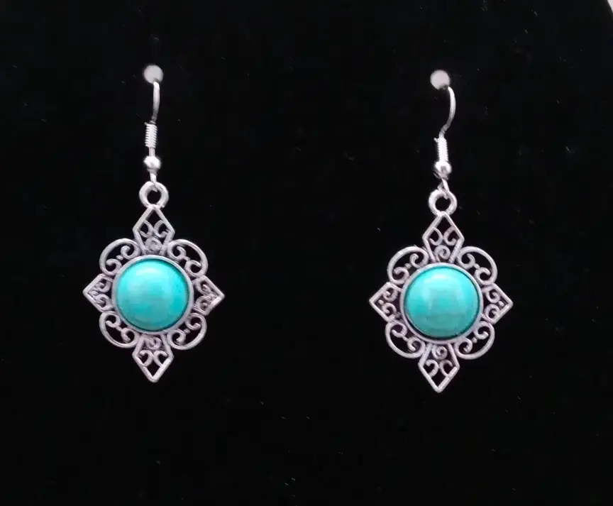 turquoise and silver earrings .