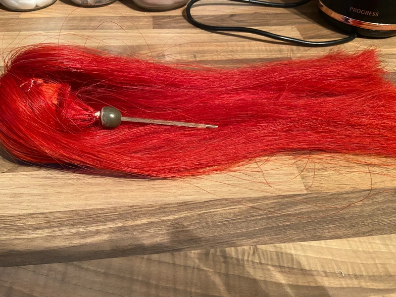 Orange/red household calvery plume top