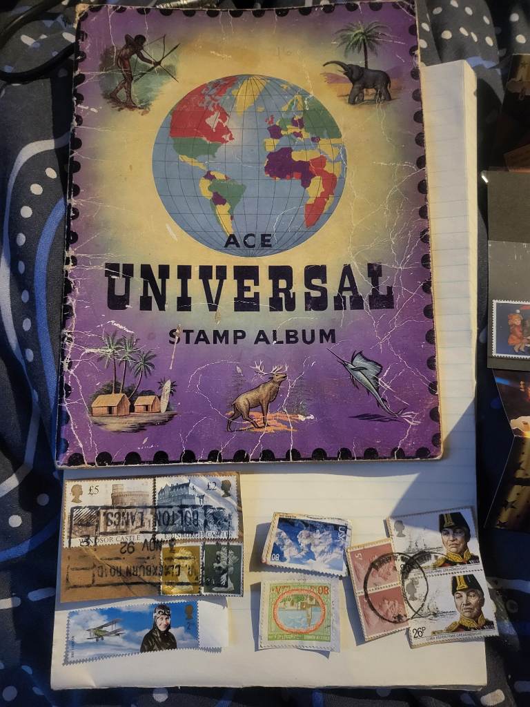 Vintage universal stamp collectors book with 50+ Vintage stamps