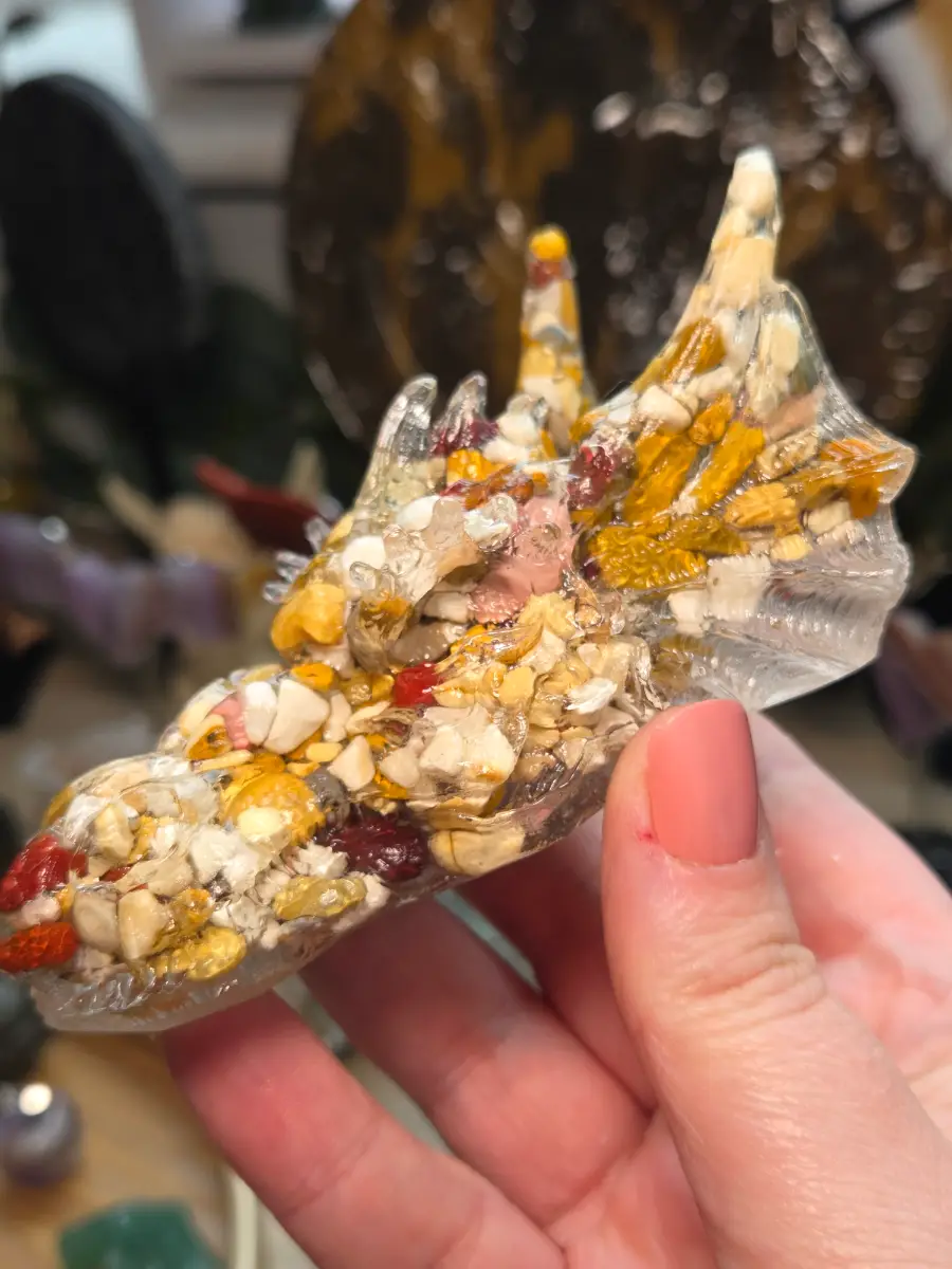 Mookite crystal dragon head set in resin