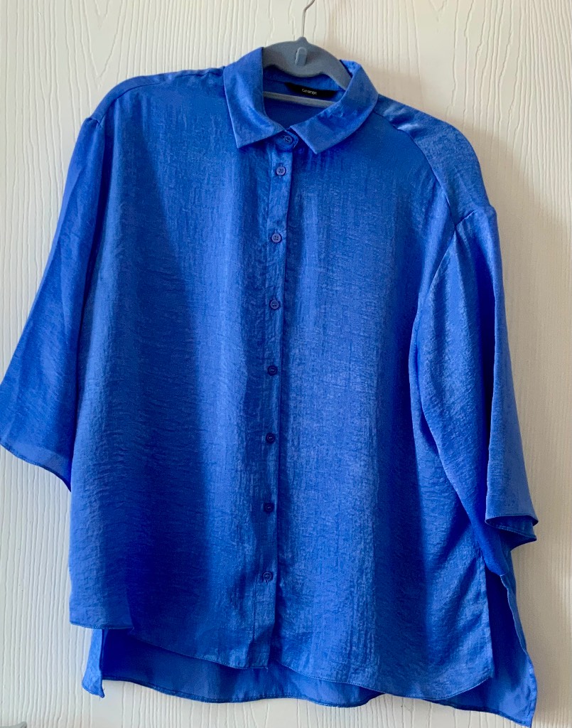 A gorgeous blue satin feel oversized top size 10  by George . Never worn