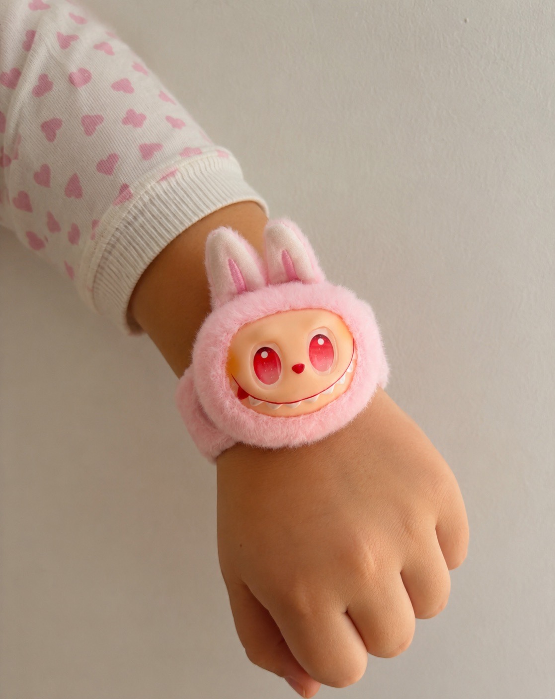 Fluffy pink cute monster face wrist slap band