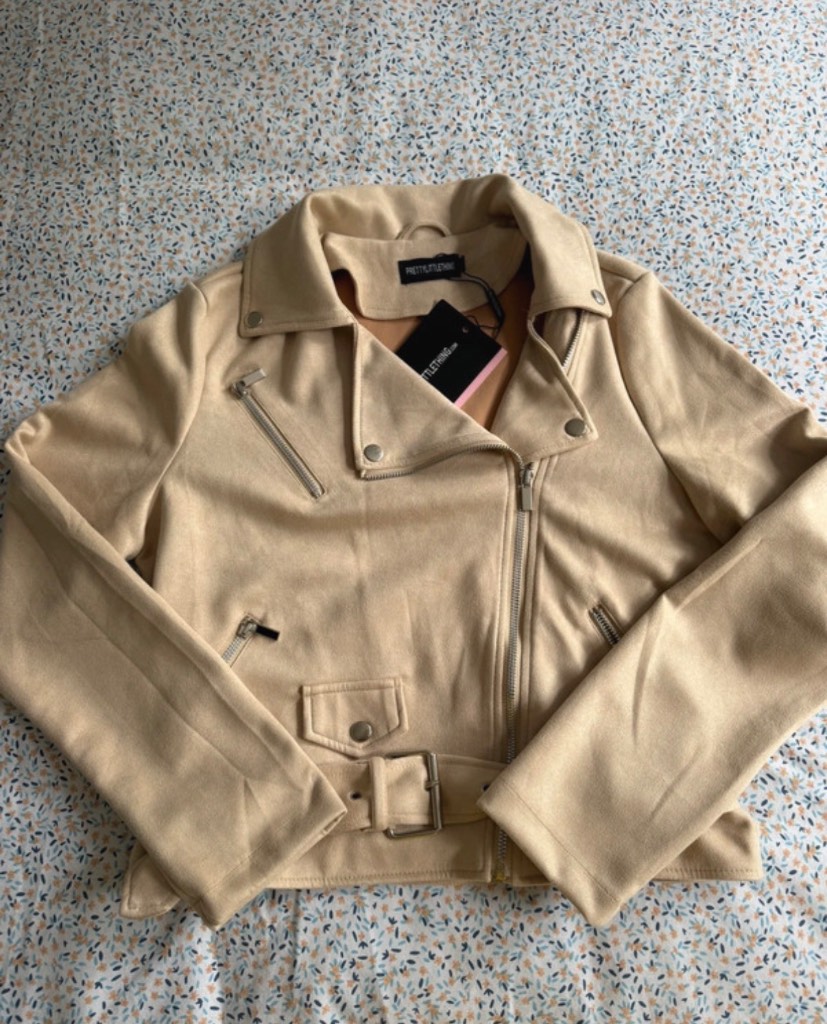 Beige/nude suede biker jacket with removable belt.