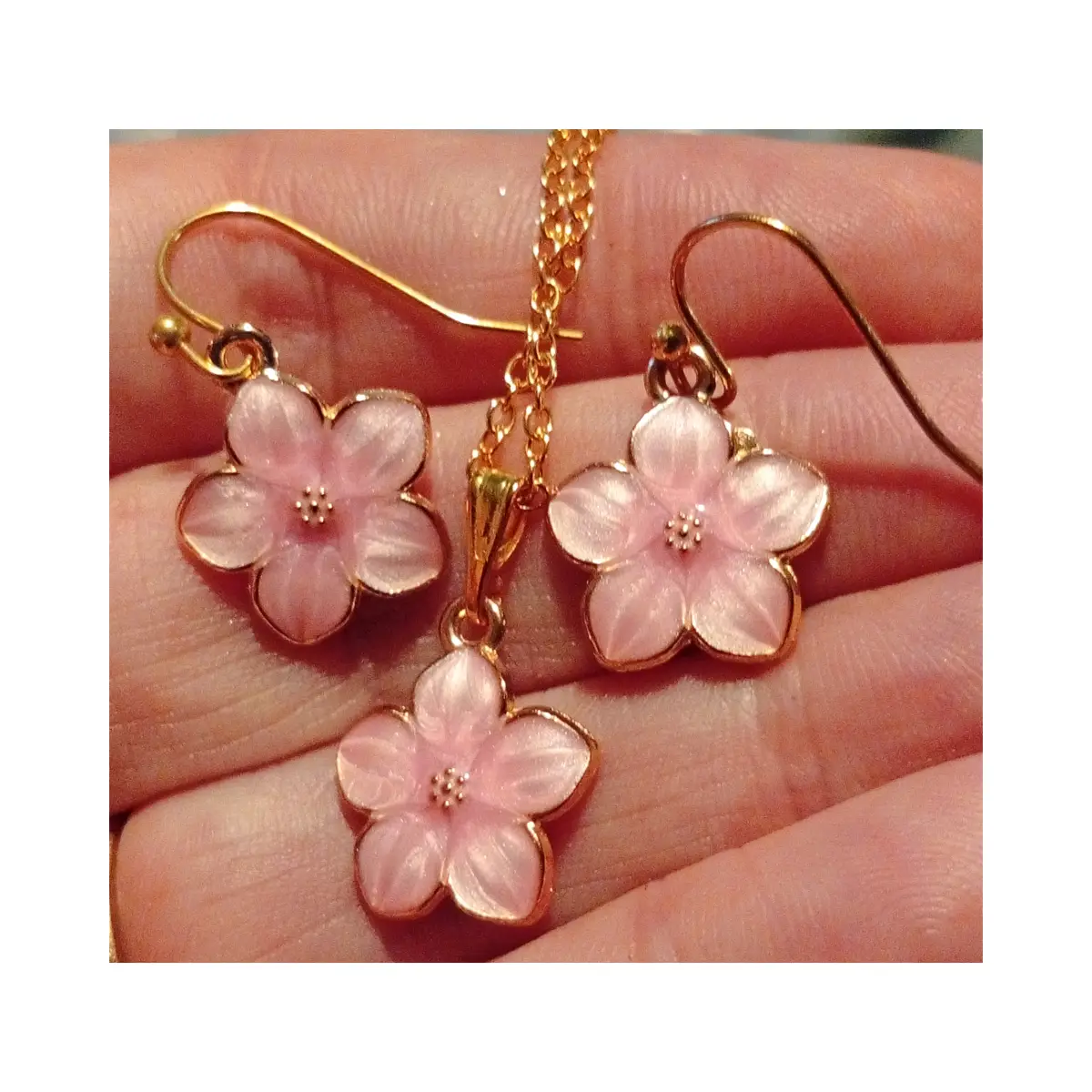 Pretty pink floral design earrings and necklace set. Boxed