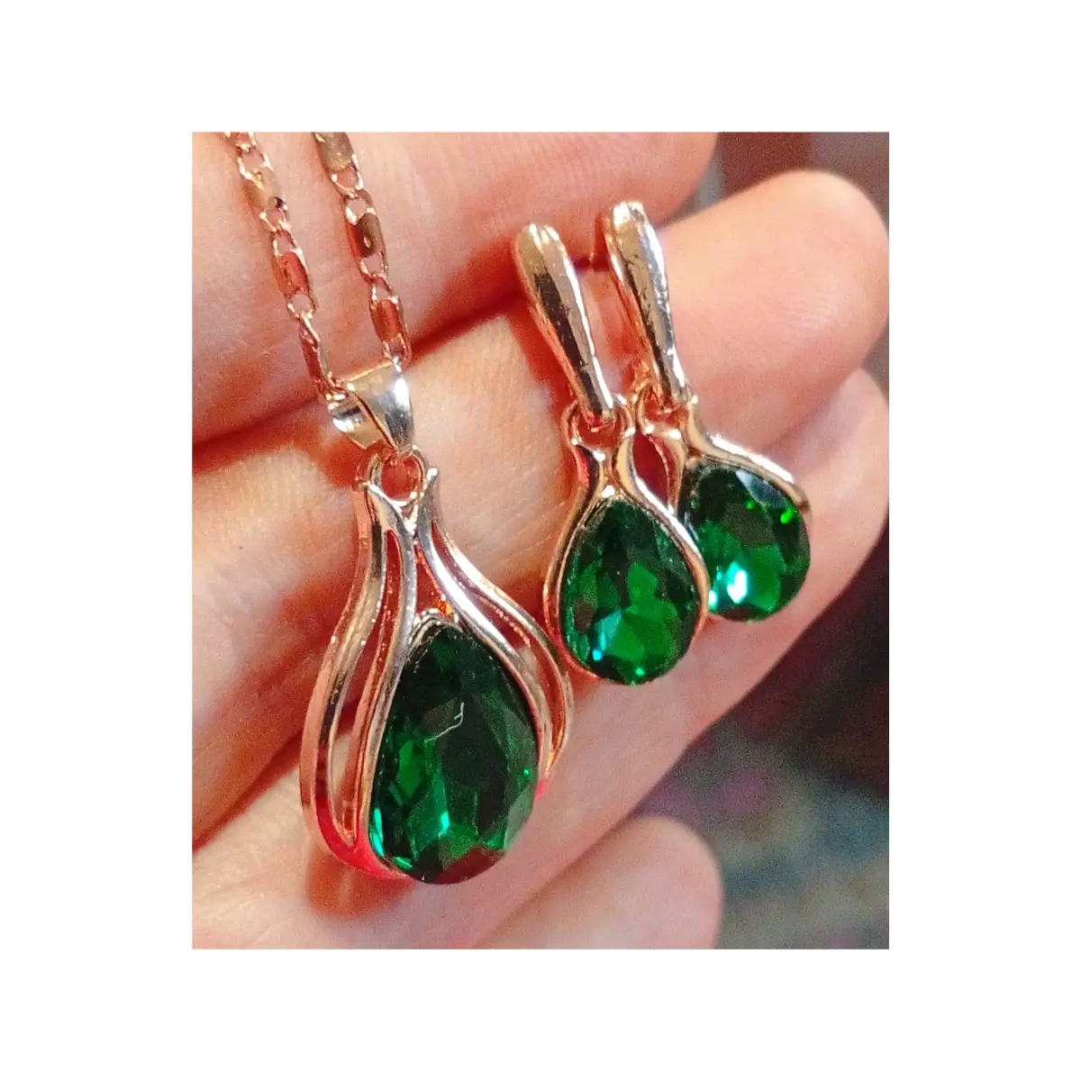 Beautiful faux emerald earrings and necklace set. Boxed.