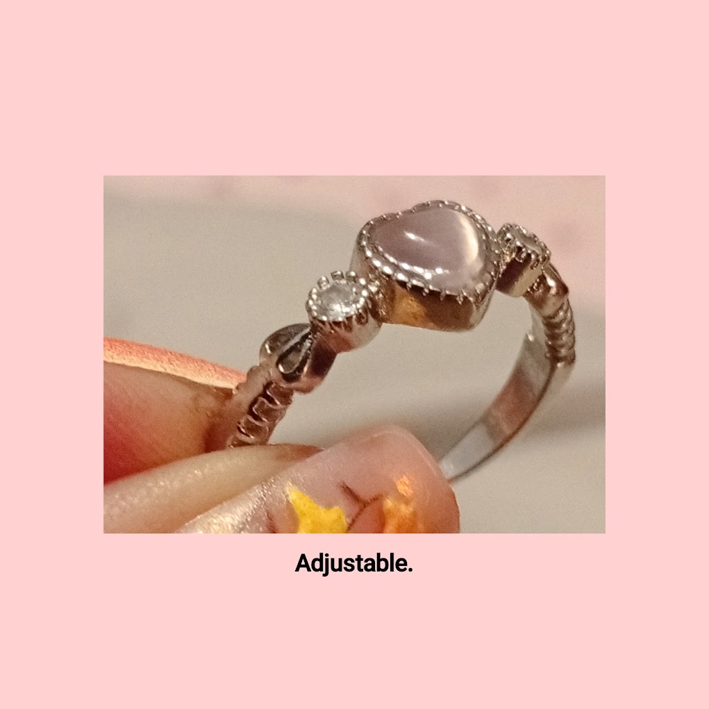 Pretty adjustable ring with opaque pink heart and diamante detail. Dainty and cute.