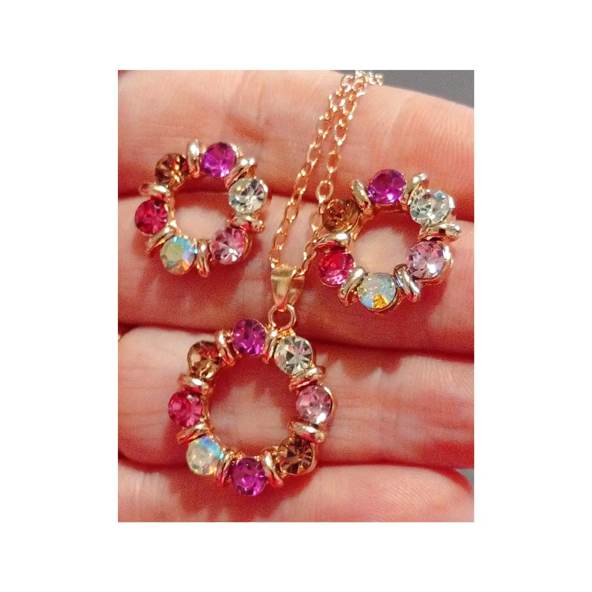 Beautiful multicoloured circlet style diamanté earrings and necklace set. Boxed.