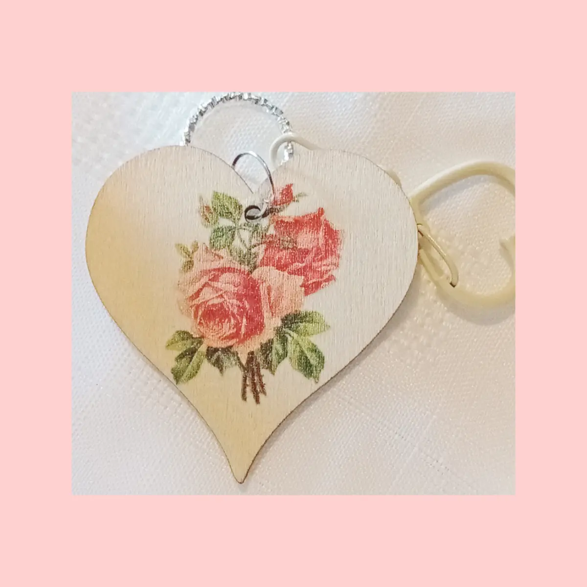 Beautiful personalised keyring. Wooden heart shaped with pink rose design.
