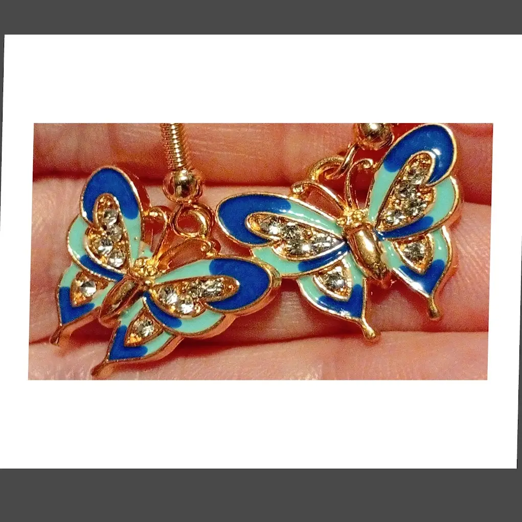Beautiful Enamel and diamante detail butterfly design earrings blue and green. Dangle style.
