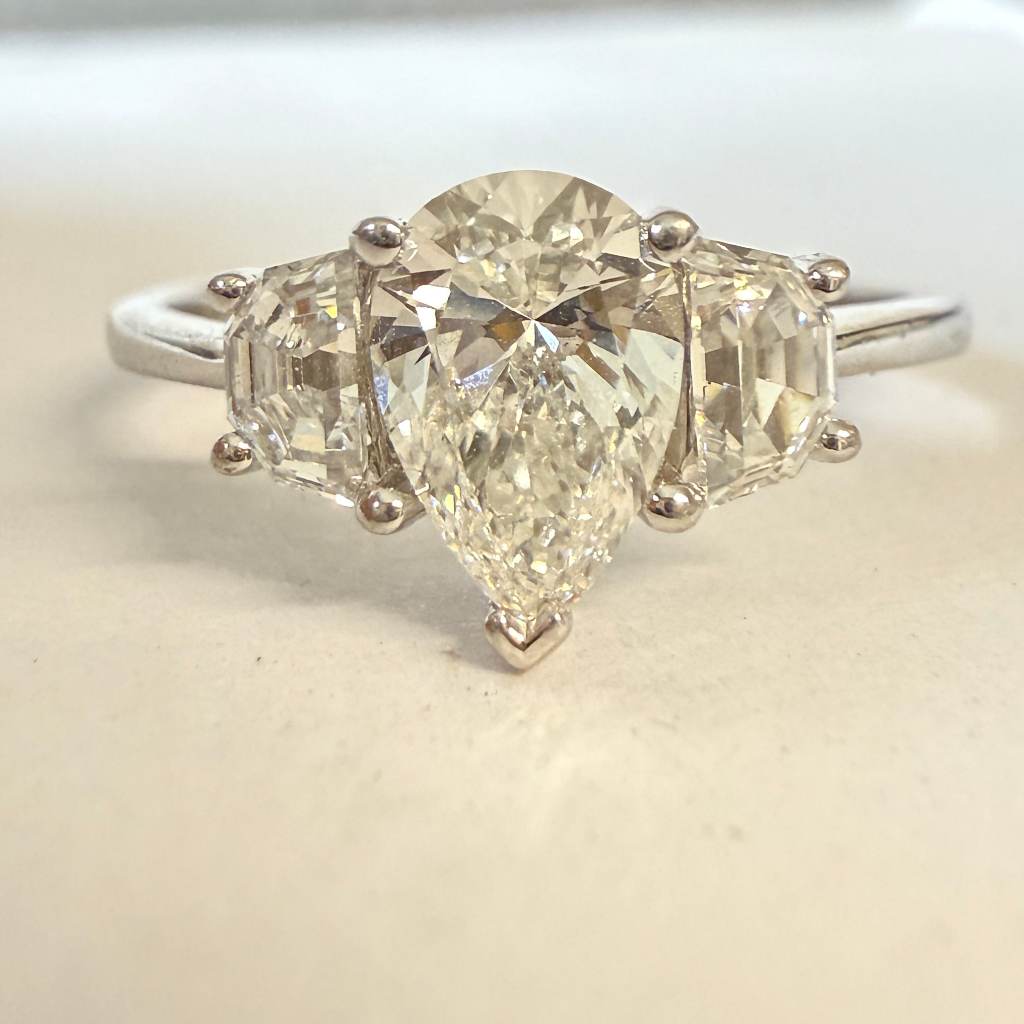 Platinum Set Lab Grown Pear Cut Diamond Three Stone Engagement Ring. Size T