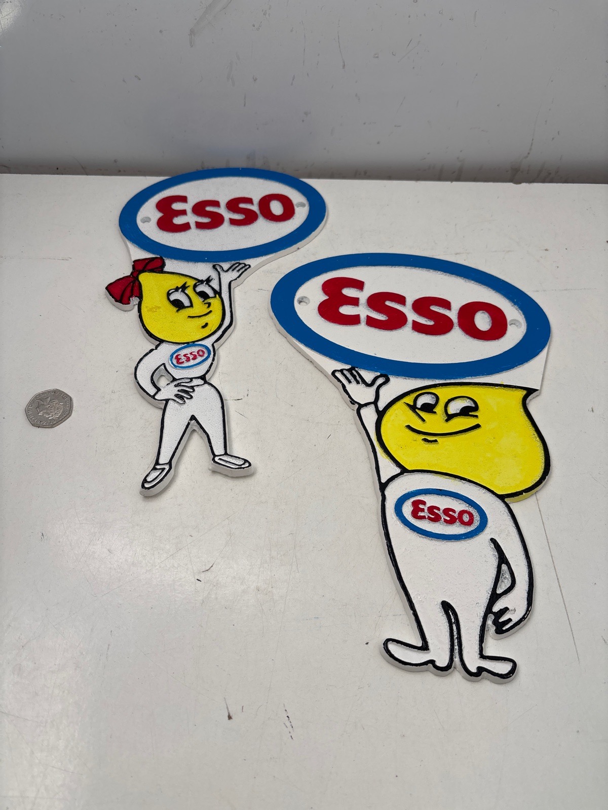Cast iron pair esso signs