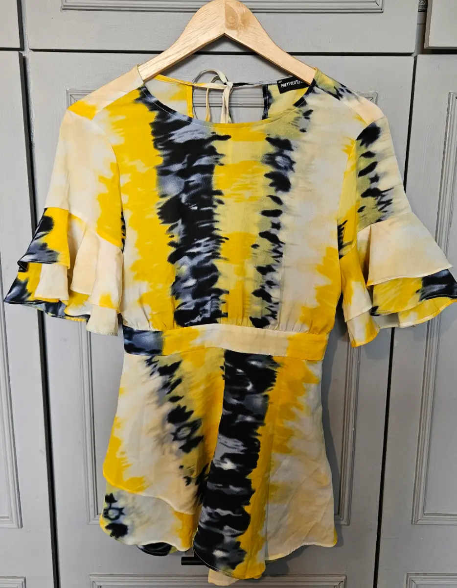 Pretty Little Thing Open Back Black, Yellow and White Tie Dye Frill Short Sleeve Playsuit - Size 10