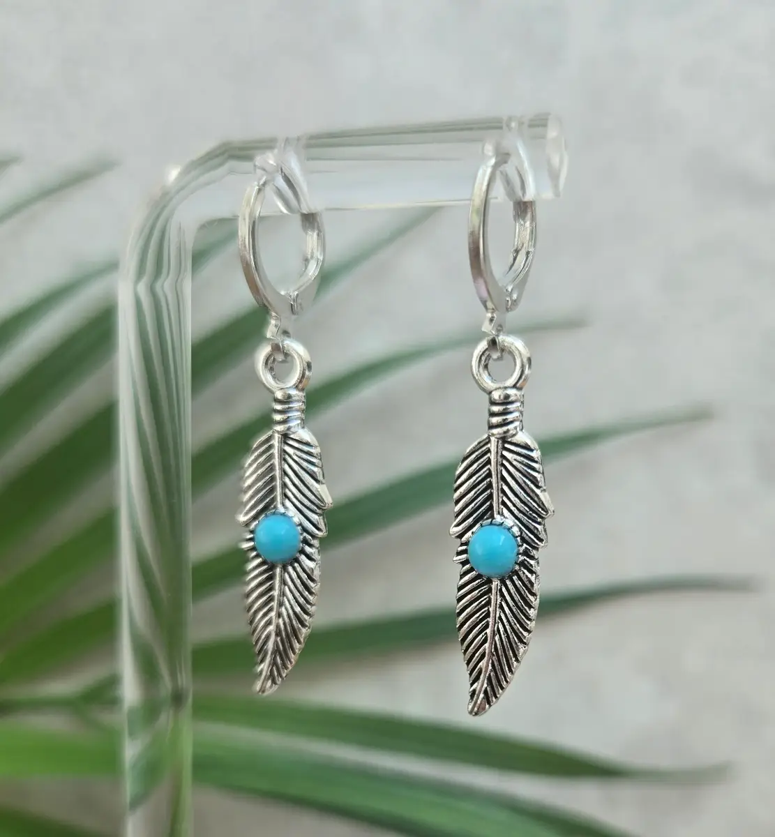 Beautiful boho style feather huggie hoops