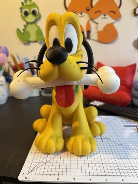 Adorable Disney Pluto figurine. Stands 25cm tall