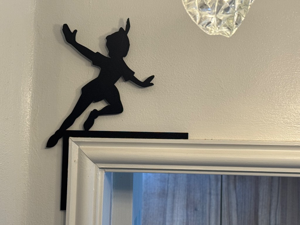 Adorable Disney Peter Pan over the door frame sign
