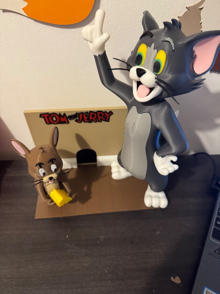 Adorable Tom and Jerry figurine with stand