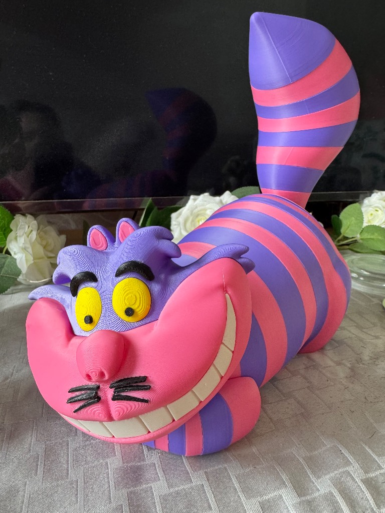 Disney Cheshire Cat figurine.