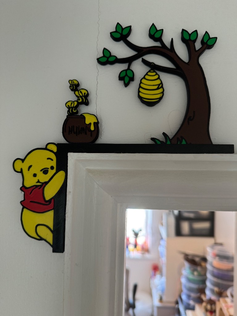 Adorable Disney Winnie the Pooh over the door frame sign