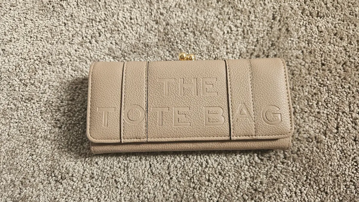 The tote purse in beige. Brand new