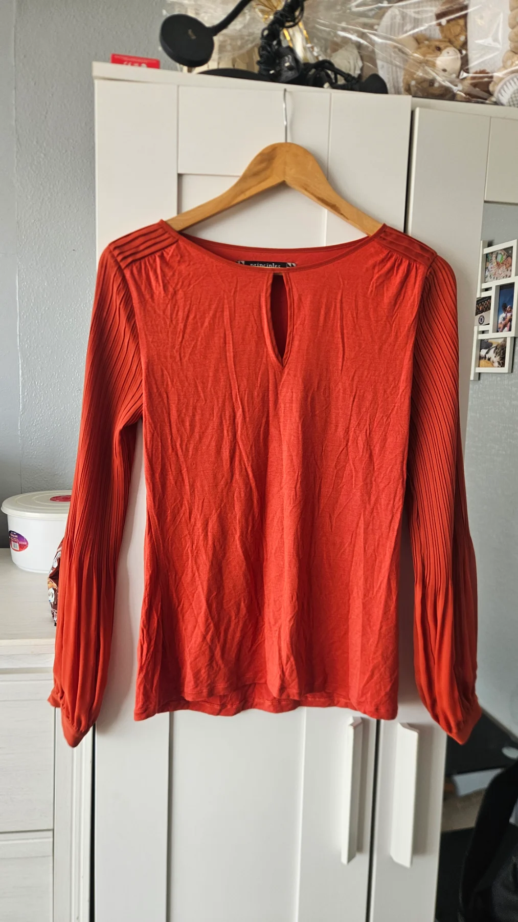 A cute principles long sleeve top with sheer flowy sleeves. Only the sleeves are slightly sheer. Sma