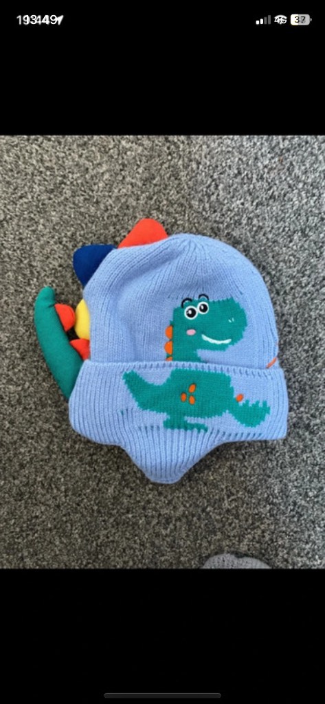 Boys blue dinosaur shaped knitted hat