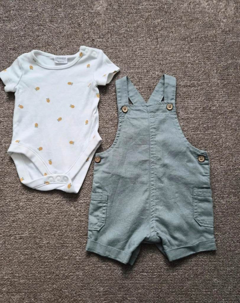 F&F baby set with white bodysuit with a pinapple print and sage green dungaree shorts