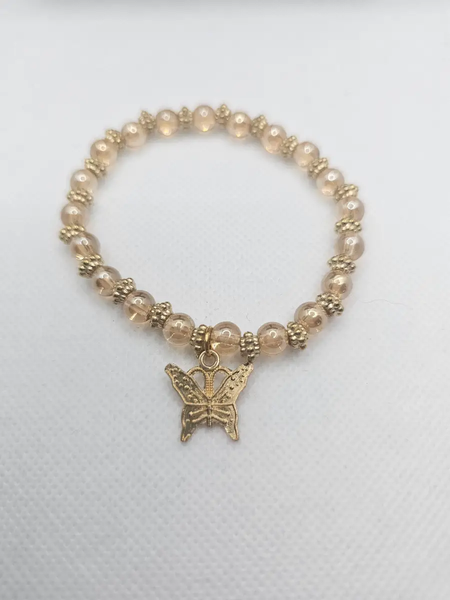 Gold and clear brown beads with butterfly