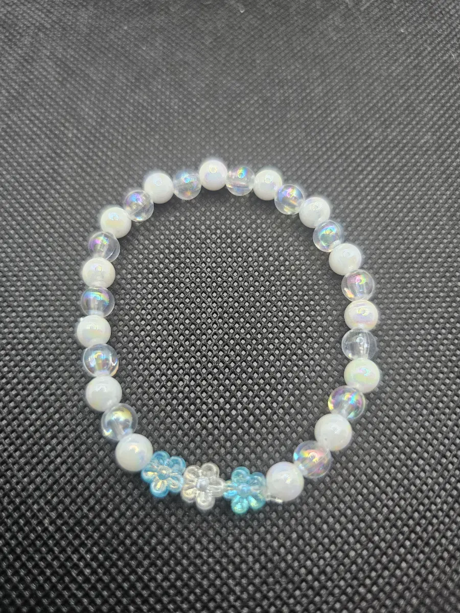 Clear white iridescent bracelet with flowers