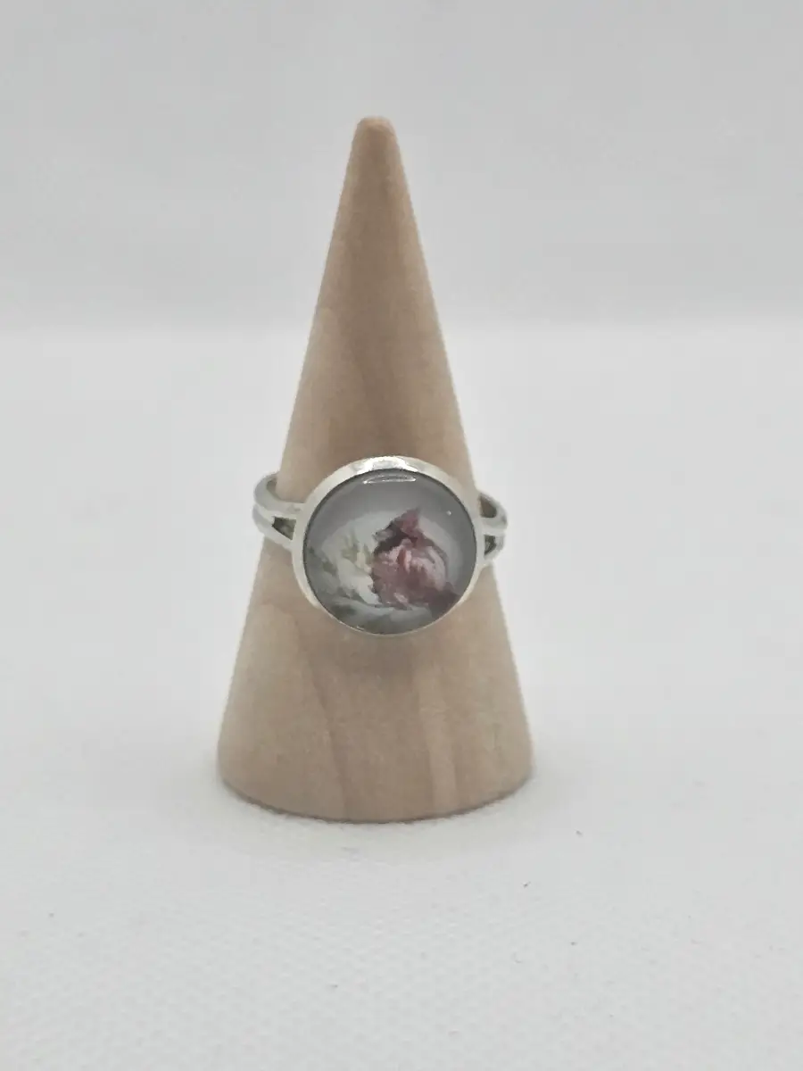 Adjustable silver ring with a bird design