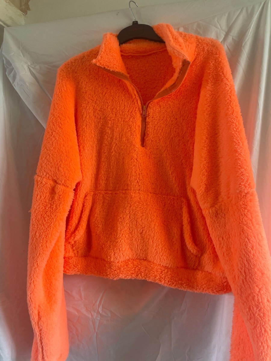 Orange fleece jumper in size medium n good condtion