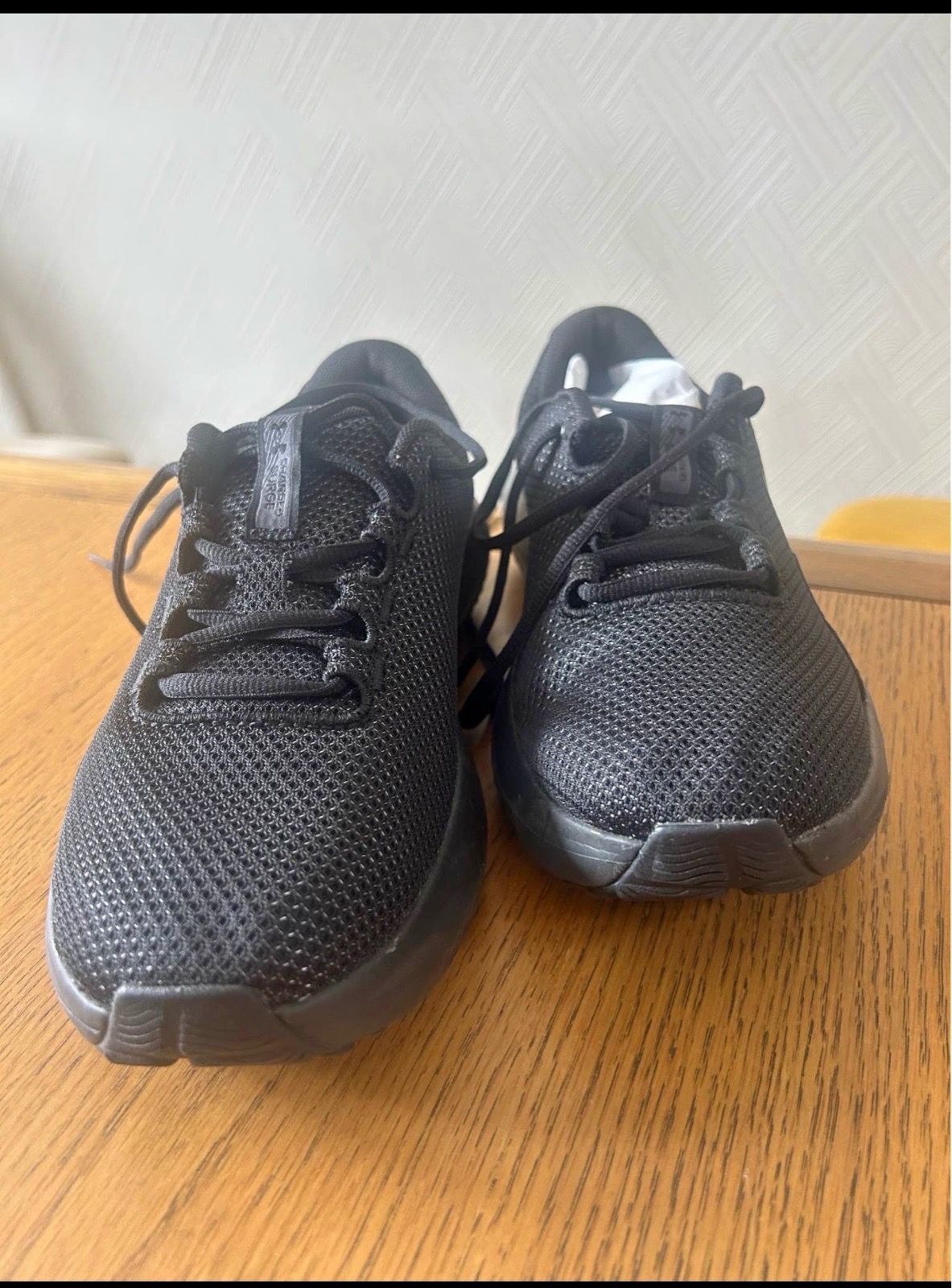 Under Armour Women's Charged Surge 4 Running Shoes in black