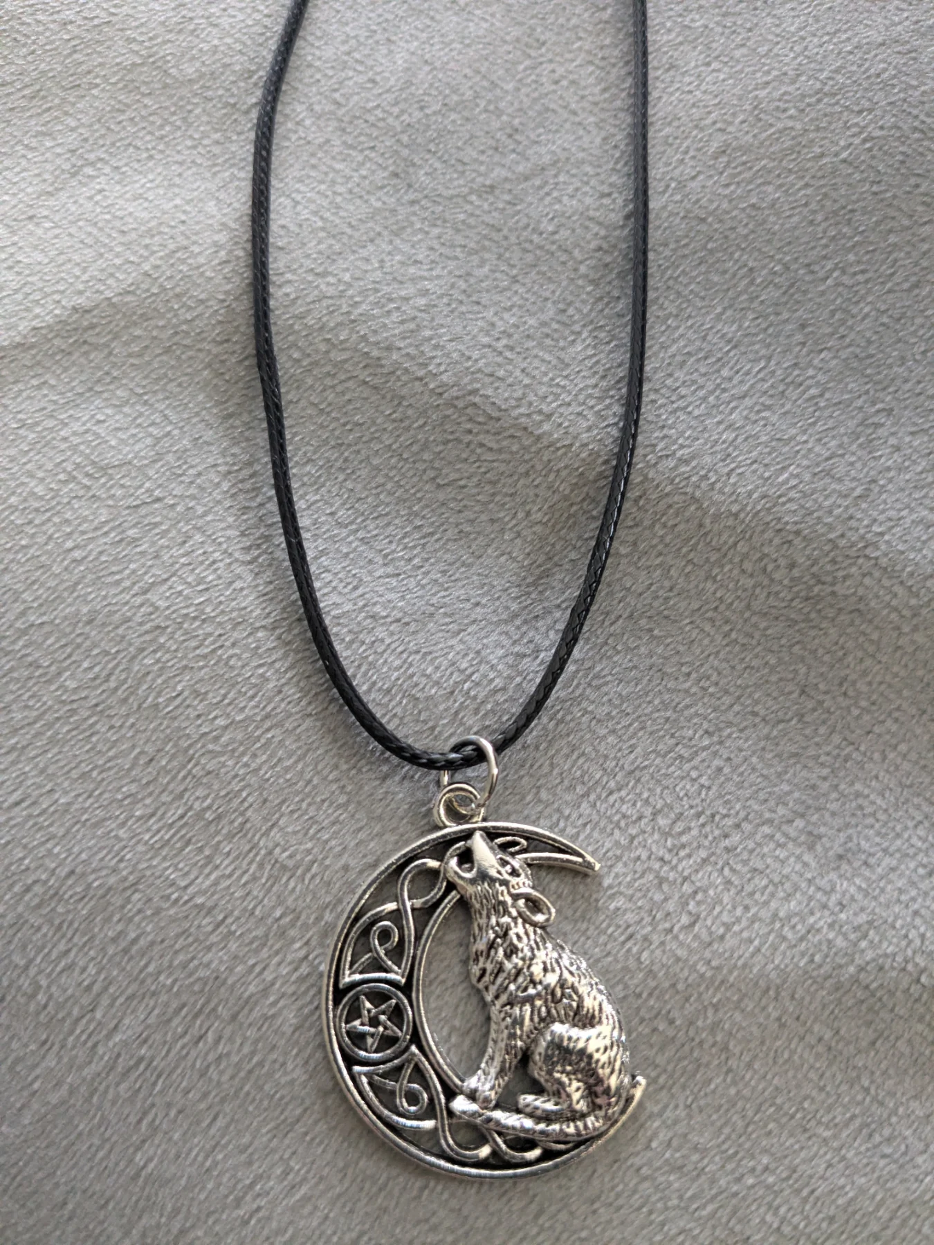 Wolf on Moon corded necklace.