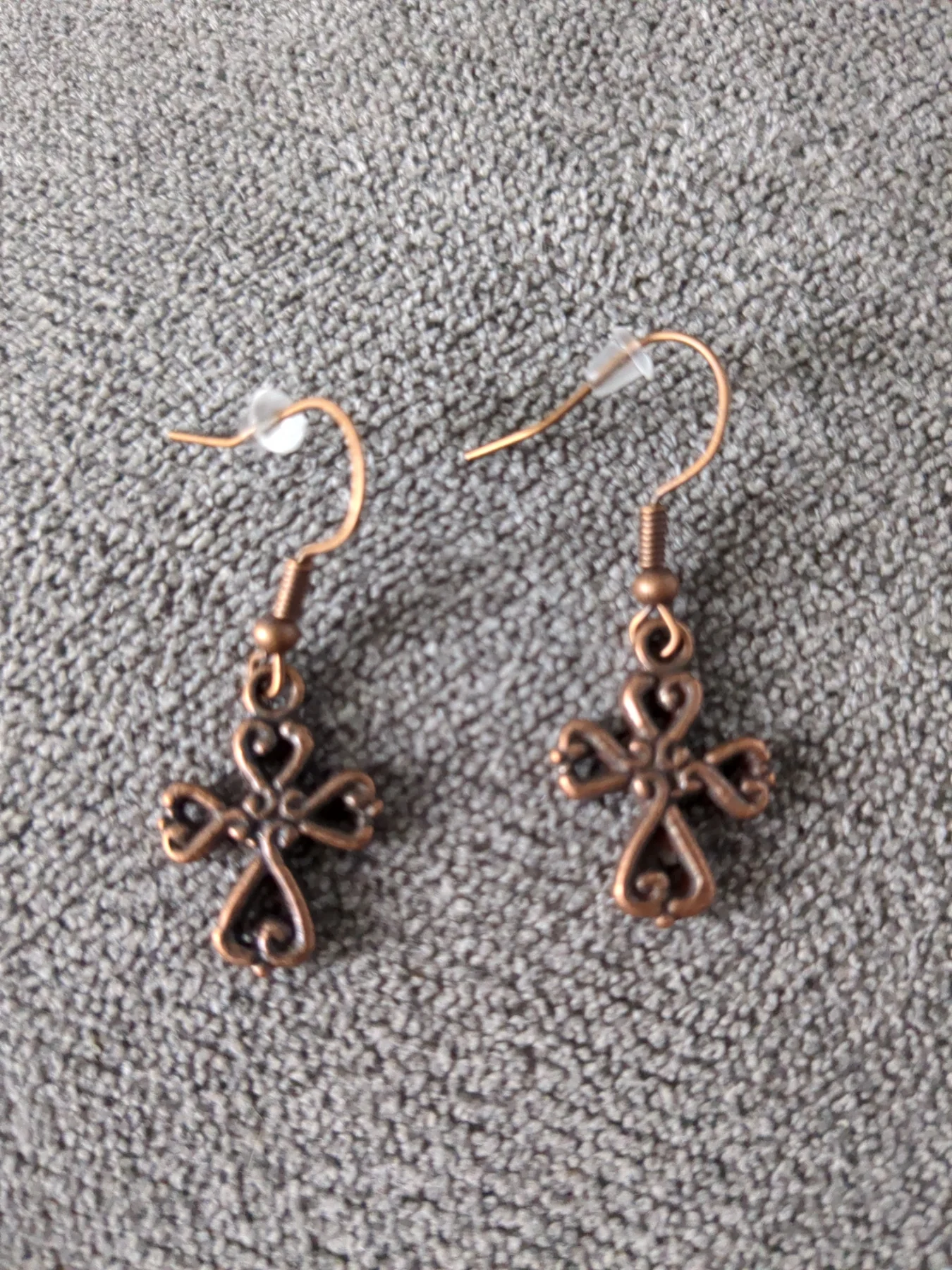 Copperish coloured cross earrings. New