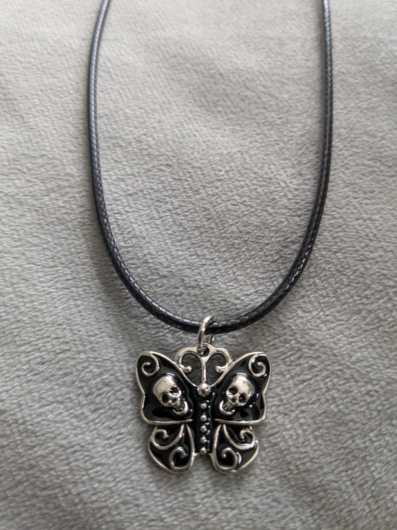 Alternative butterfly skull necklace.