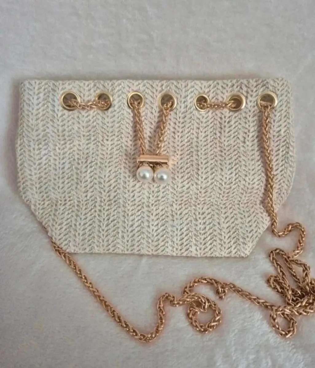 Ladies cream woven straw across body handbag