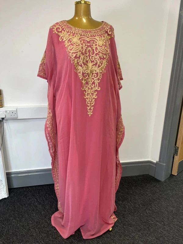 Women’s pink and gold long double layered abaya bought in Dubai