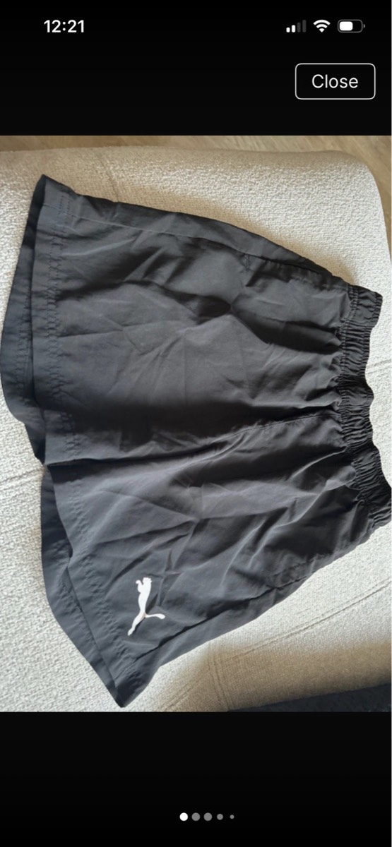 Boys black Puma shorts aged 11-12