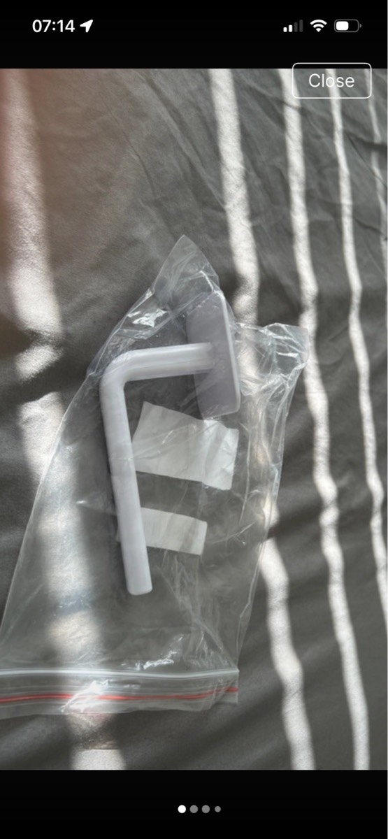 Self adhesive baseball cap holder