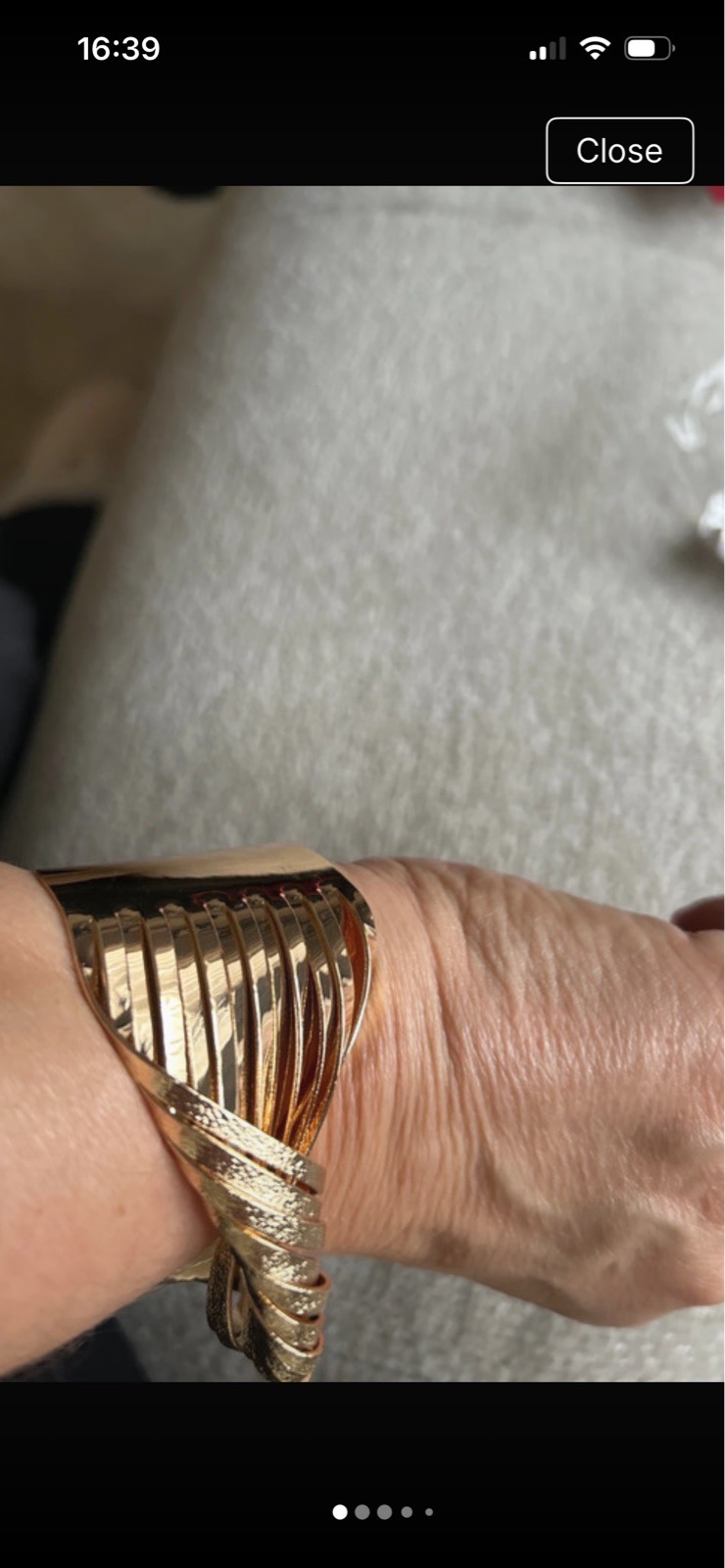 Gold coloured twisted bangle