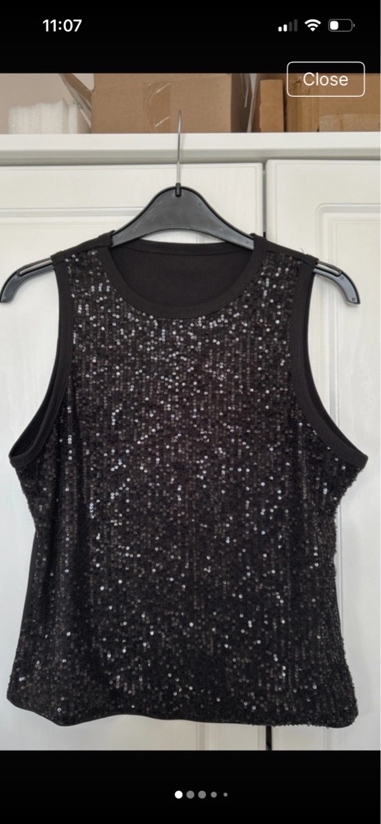 Dressy sequinned black vest top size 10-12