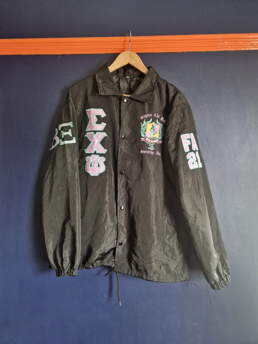 Sigma Chi Fraternity Jacket with embroidered Greek letters and crest.