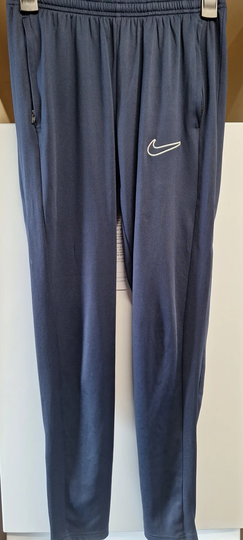 Nike tracksuit bottoms with side zip pockets and zip ankle