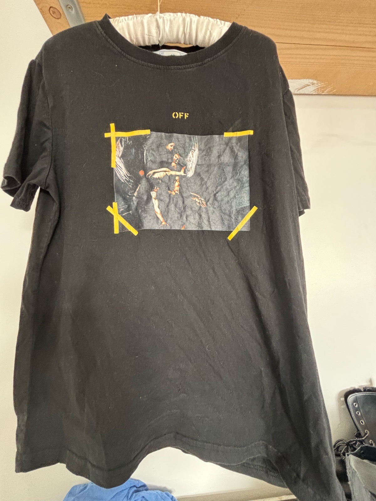 Off-White Caravaggio print T-shirt in black featuring a framed Renaissance painting graphic